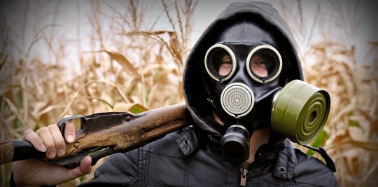 Gas-Mask-On-A-Man-With-A-Rifle.jpg