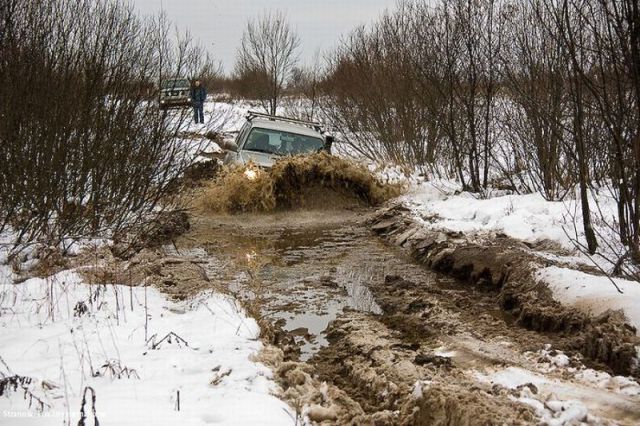 misc-off-roading-four-wheel-drive-jeep-driving-through-the-snow-and-mud-and-slush-in-the-mountains.jpg