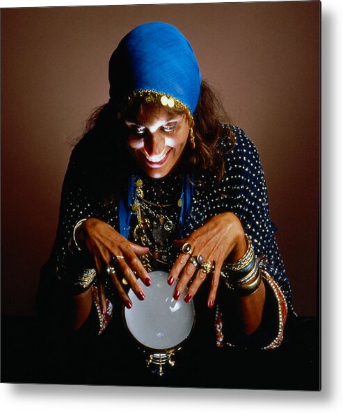 mature-woman-dressed-as-gypsy-looking-into-crystal-ball-headhunters.jpg