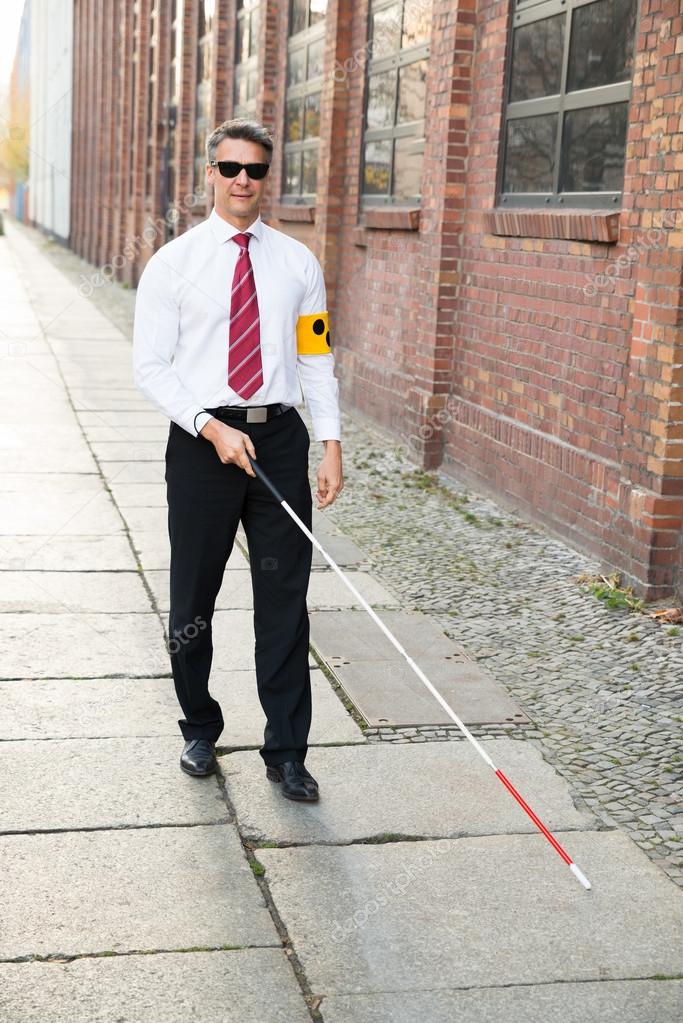 depositphotos_62716963-stock-photo-blind-man-walking-on-sidewalk.jpg
